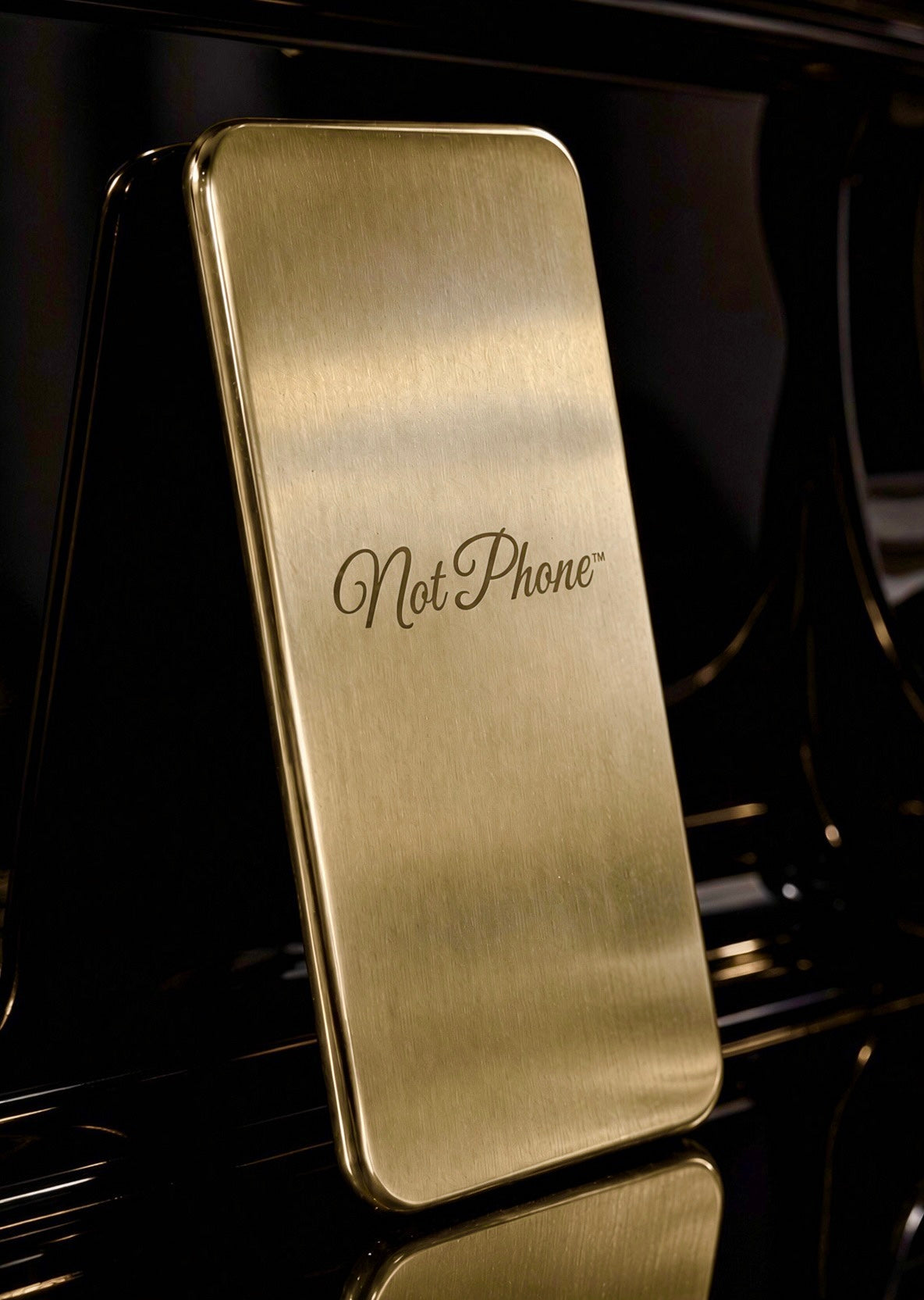NOT PHONE™ Classic. standing upright, hairline brass face and polished edge