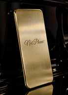 NOT PHONE™ Classic. standing upright, hairline brass face and polished edge
